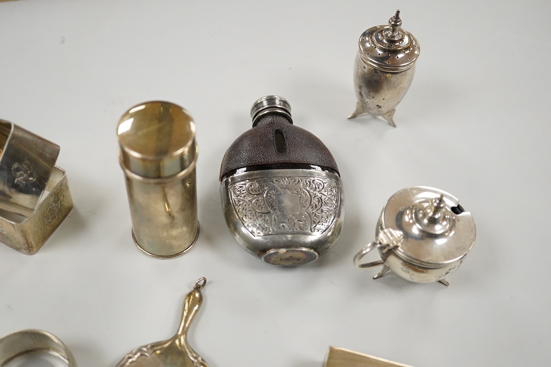 Sundry small silver, including two cigarette cases, a match sleeve holder, three napkin rings, two condiments, matchbox sleeve, shaving brush canister, commemorative small dish, a mounted hand mirror and mounted handbag